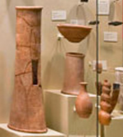 more stands with clay serpent patterns