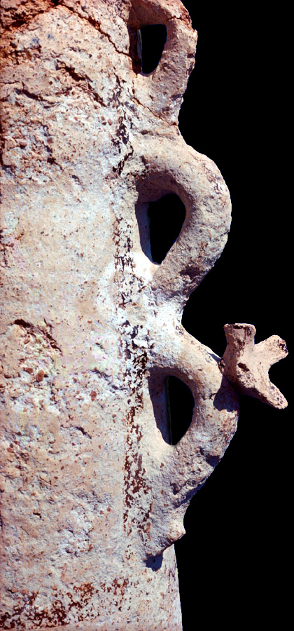 closeup of Cretan snake tube showing undulating serpent handle of ceramic stand