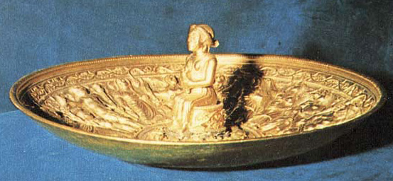 elaborated worked golden plate with goddess figure rising up in center