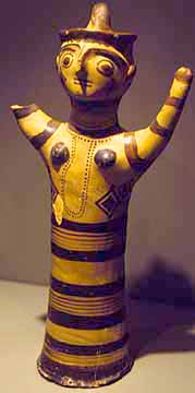 clay woman with upraised arms, cylindrical body