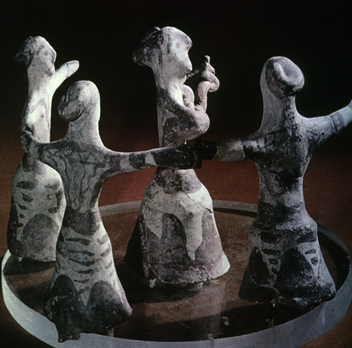circle of dancing women, one in center playing lyre