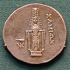 coin showing goddess with adornments