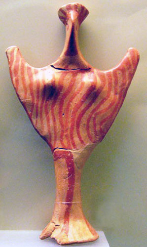 abstract female figurine with upraised arms and red-painted body