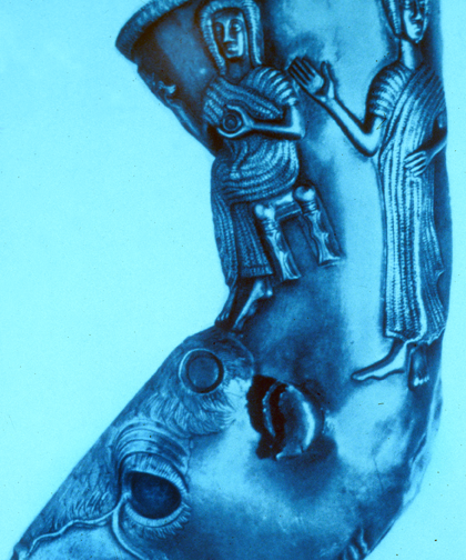 rhyton with seated woman uncovering and cupping her breast