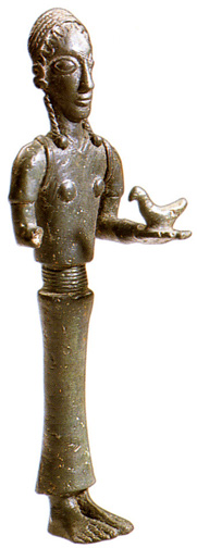 bronze woman with cinched belt holding bird in left hand