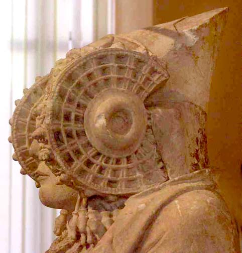 side view of the wheel-like headdress ornaments