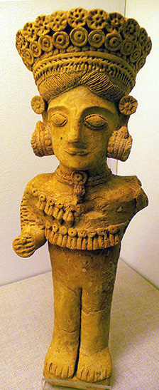 naked goddess with elaborate headdress and jewelry