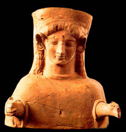 terracotta statue of Tanit with polos headdress and arms reaching forward, from waist up