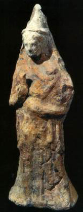 clay figurine with peaked headdress