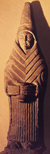stylized sculpture of woman standing with offering cup and tall peaked headdress