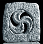 three-armed spiral cut out of stone