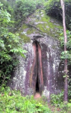 vulva-shaped gray stone with reddish split