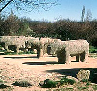 row of stone bulls