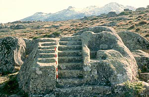 steps carved into granite block on land