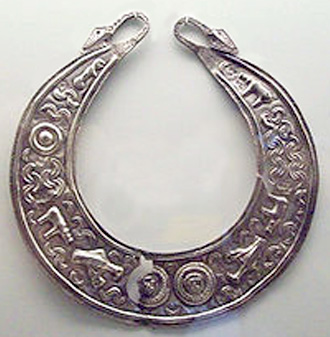 deeply curved crescent torc with figures of animals and other patterns