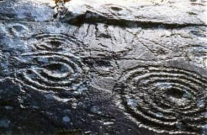 Petroglyphs on rock face at Derrynablaha, County Kerry