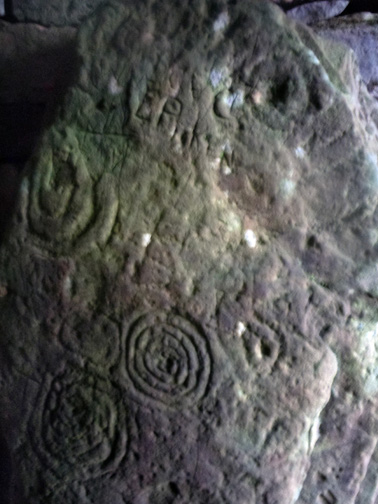 Stone with vulvas, passageway into Cairn T chamber