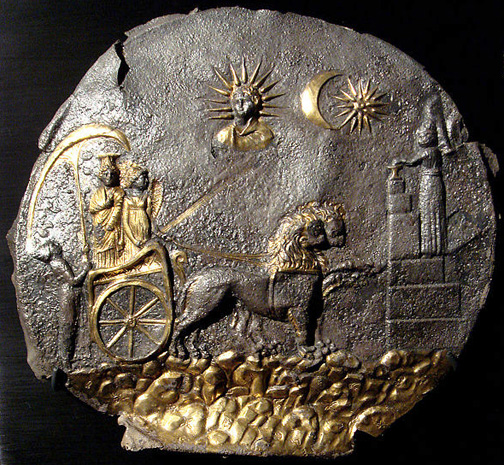 silver disc with two goddesses in a chariot, sun and moon above, and a magus