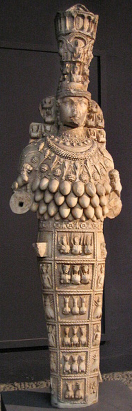 marble sculpture of Artemis of Ephesus with fruited pectoral, outstretched hands, and tall polos headdress