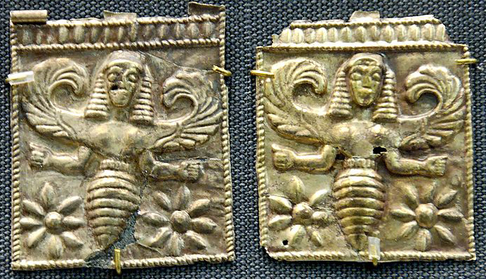 two golden plaques showing bees with women's heads