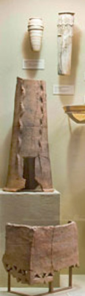 clay stand with vertical serpent applique