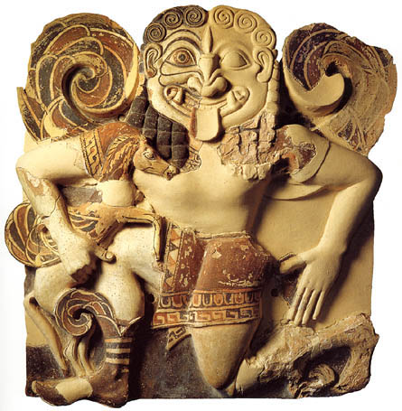 Gorgon painted in gorgeous ochre colors, half-running, half-kneeling
