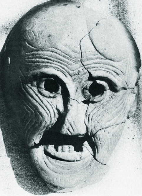 old woman's face with swirling line patterns and a few missing teeth, smiling