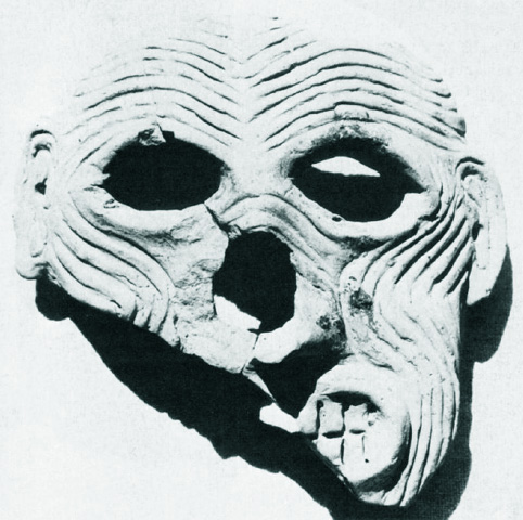 heavily wrinkled face with almost skull-like quality