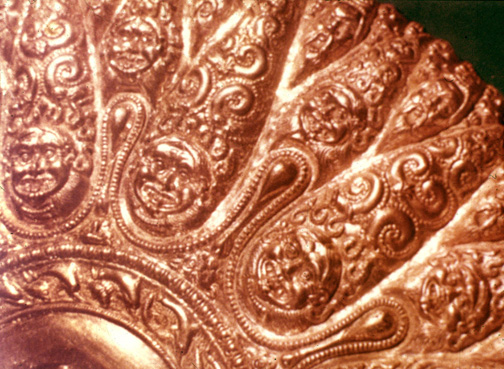 grinning Gorgons chased onto a gold vessel