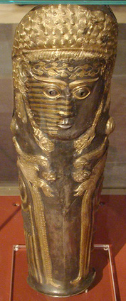 silver and gold shin-protector
