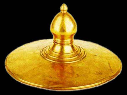 flat golden disc with peaked top
