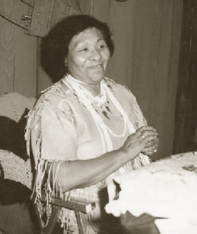 woman seated at crafts table